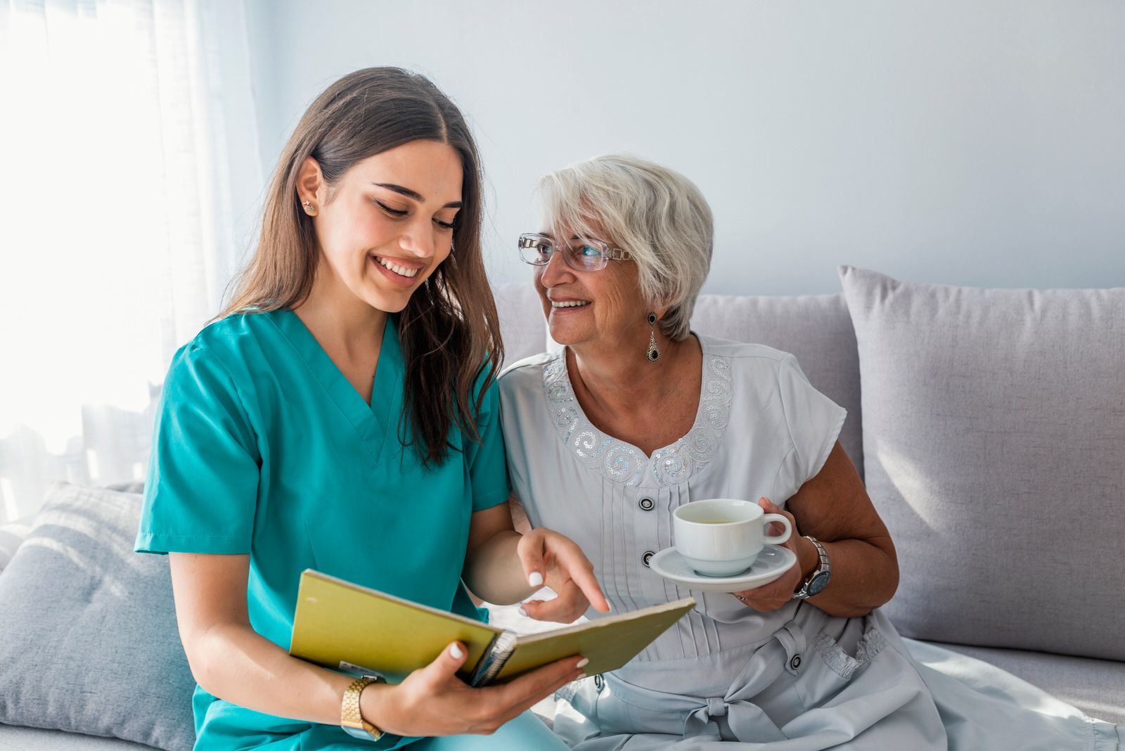 Woman reading to senior